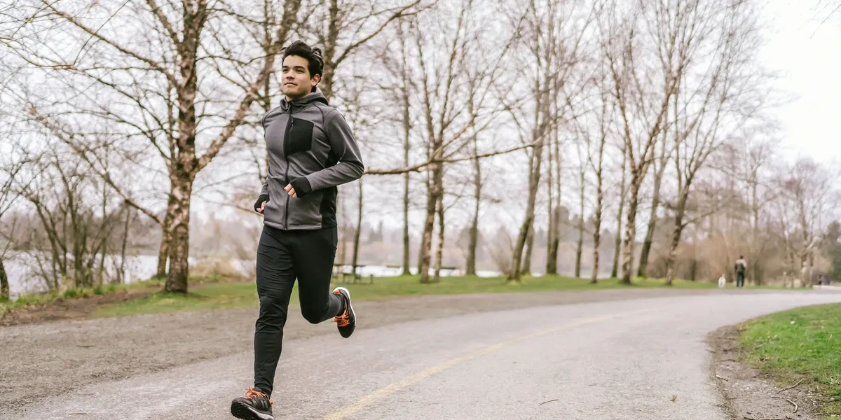 Individual exercising outdoors on a cloudy day