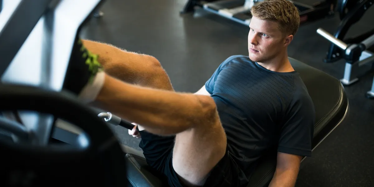 Intense leg exercise in gym