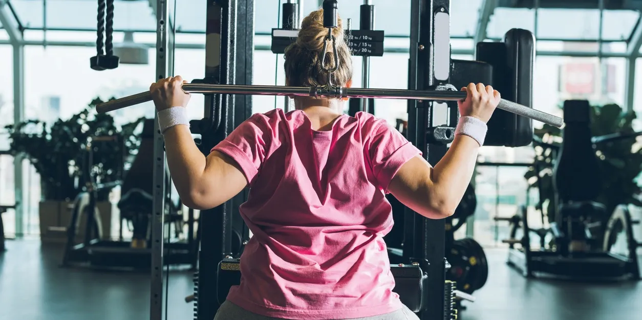 Fitness training with weight machine