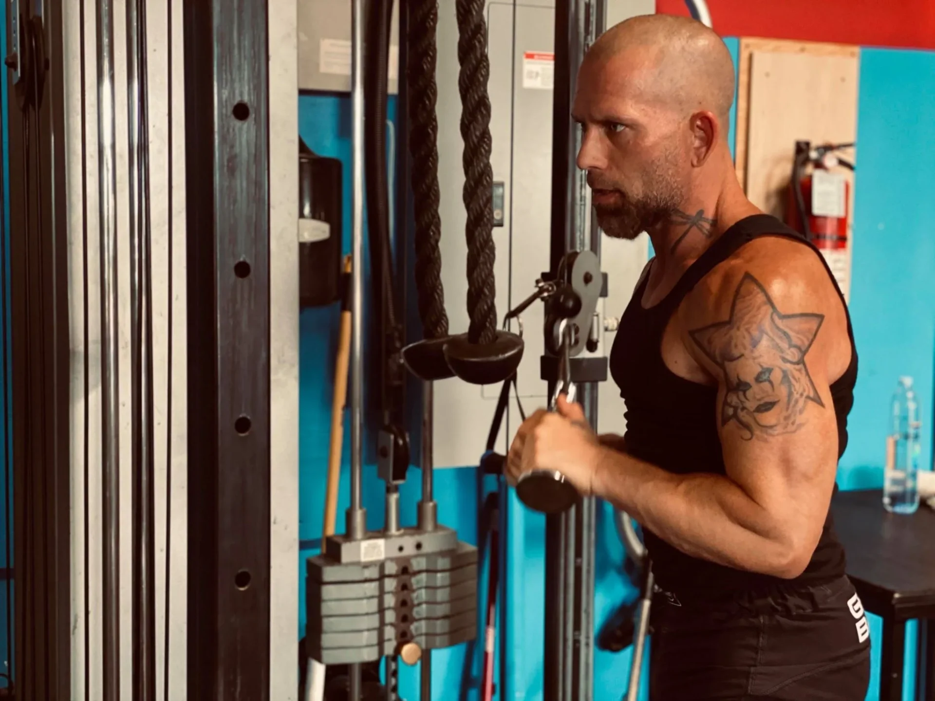Gym workout with cable equipment